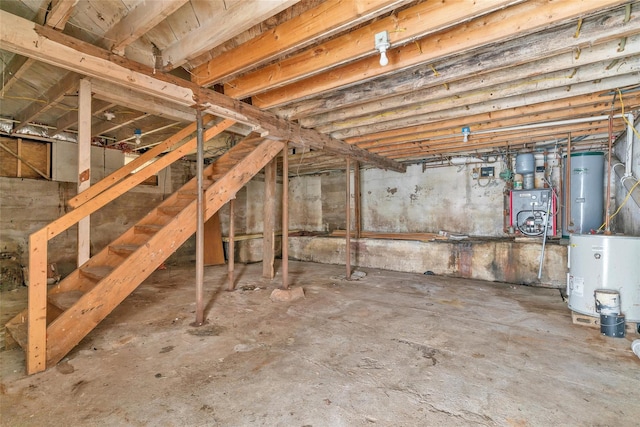 unfinished basement with water heater and a heating unit