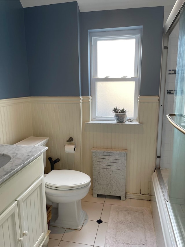 20815 38th Ave, Bayside, NY 11361 - full bathroom featuring wainscoting, toilet, tile patterned flooring, vanity, and healthy amount of natural light