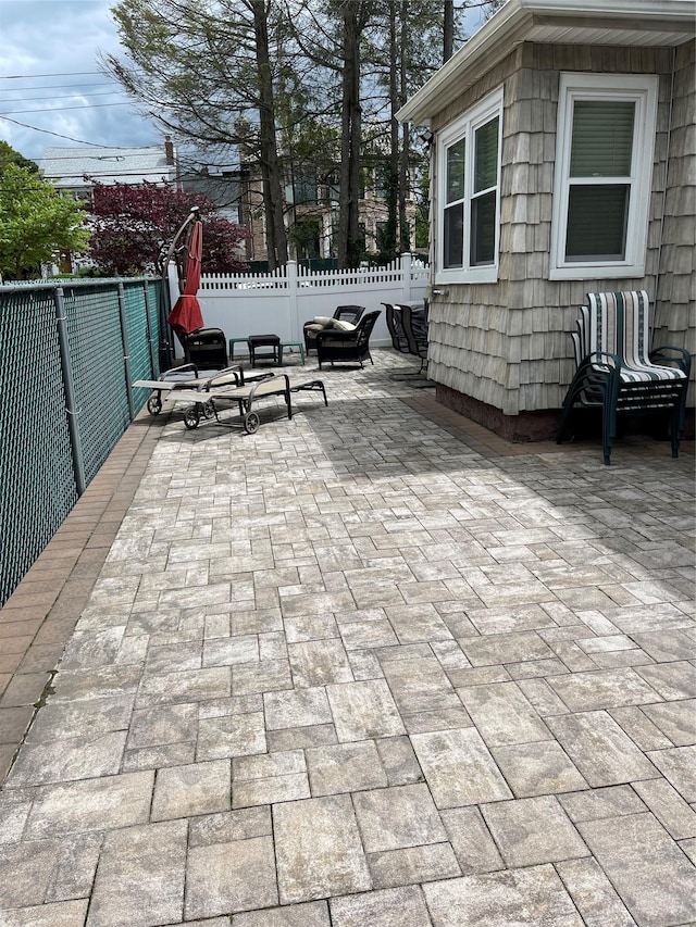 20815 38th Ave, Bayside, NY 11361 - fenced backyard with a patio area