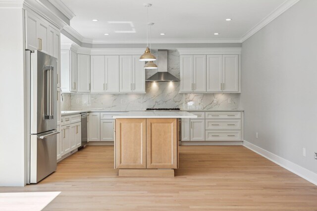 44 Harbor Hills Dr, Port Washington, NY 11050 - kitchen with wall chimney range hood, tasteful backsplash, stainless steel appliances, and light countertops