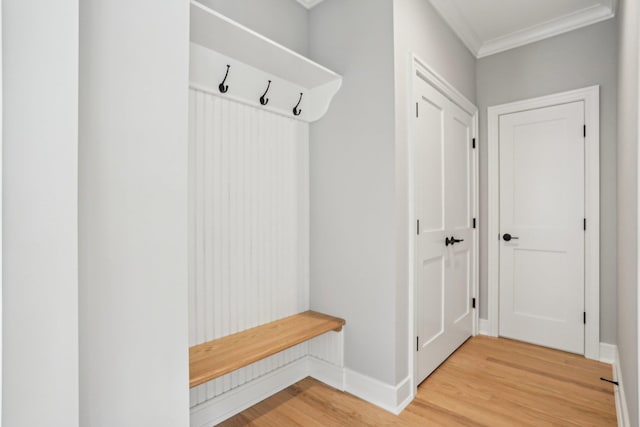 44 Harbor Hills Dr, Port Washington, NY 11050 - mudroom featuring light wood-type flooring, crown molding, and baseboards