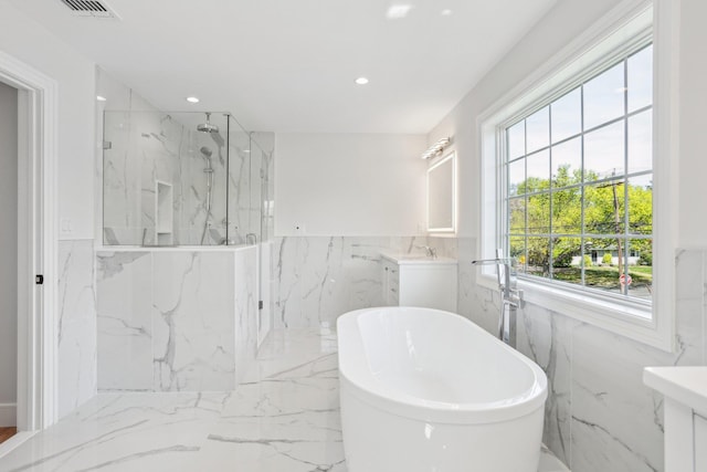 44 Harbor Hills Dr, Port Washington, NY 11050 - full bathroom with a marble finish shower, tile walls, a soaking tub, and marble finish floor