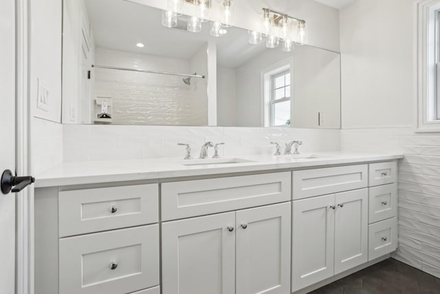 44 Harbor Hills Dr, Port Washington, NY 11050 - bathroom featuring backsplash, tile patterned flooring, a shower, and vanity