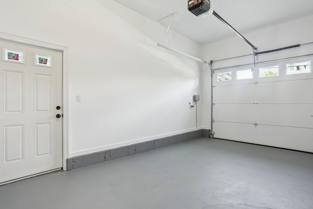 44 Harbor Hills Dr, Port Washington, NY 11050 - garage featuring a garage door opener