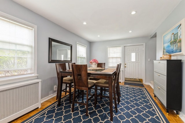 186 Stuart Rd, Valley Stream, NY 11581 - dining room with radiator heating unit, a healthy amount of sunlight, recessed lighting, and baseboards