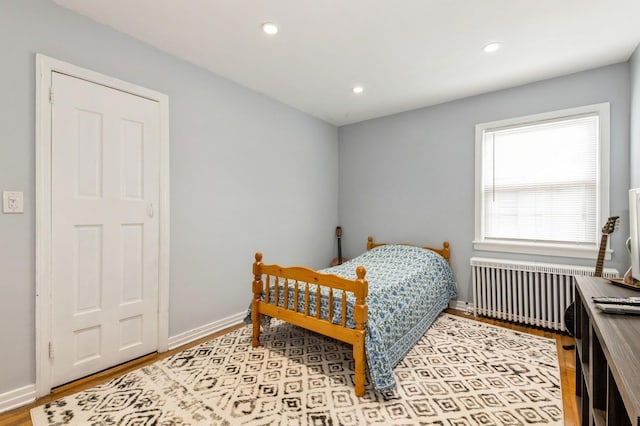 186 Stuart Rd, Valley Stream, NY 11581 - bedroom featuring radiator, baseboards, wood finished floors, and recessed lighting