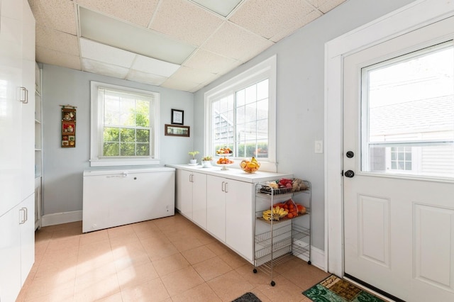 186 Stuart Rd, Valley Stream, NY 11581 - doorway featuring a paneled ceiling and baseboards