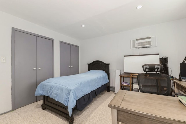 186 Stuart Rd, Valley Stream, NY 11581 - bedroom featuring recessed lighting, light carpet, multiple closets, and a wall unit AC