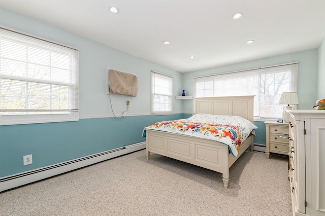 186 Stuart Rd, Valley Stream, NY 11581 - bedroom featuring a baseboard heating unit, light colored carpet, and recessed lighting