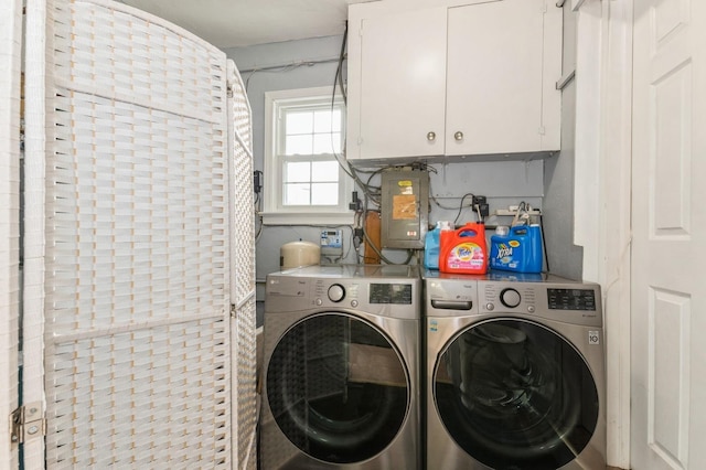 186 Stuart Rd, Valley Stream, NY 11581 - laundry room featuring cabinet space, electric panel, and separate washer and dryer