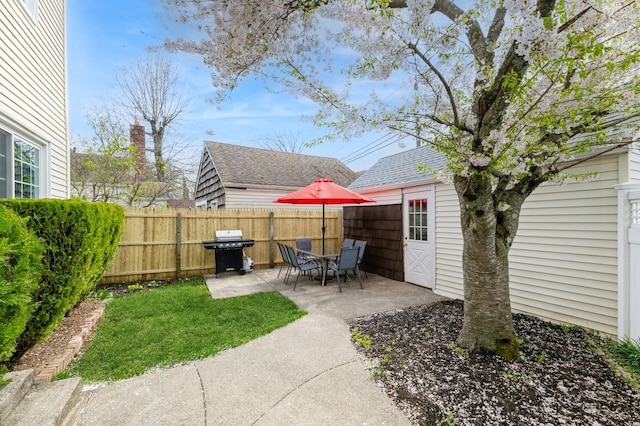 186 Stuart Rd, Valley Stream, NY 11581 - view of yard featuring an outdoor structure, a patio, and fence