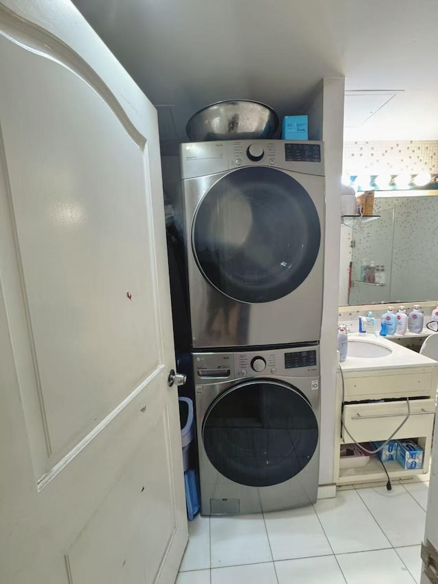 132-03 Sanford Ave Unit 2F, Flushing, NY 11355 - laundry area featuring stacked washer / drying machine and tile patterned flooring