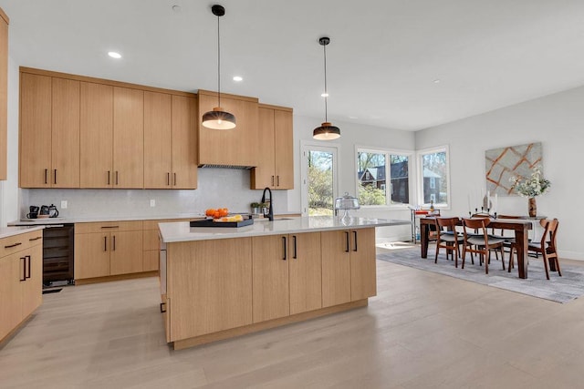 123 N Riverside Ave, Croton-On-Hudson, NY 10520 - kitchen with light brown cabinets, decorative backsplash, beverage cooler, light wood-type flooring, and light countertops