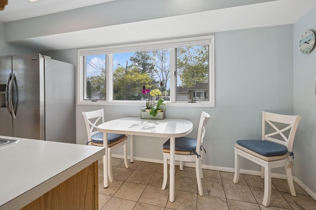 dining room with baseboards