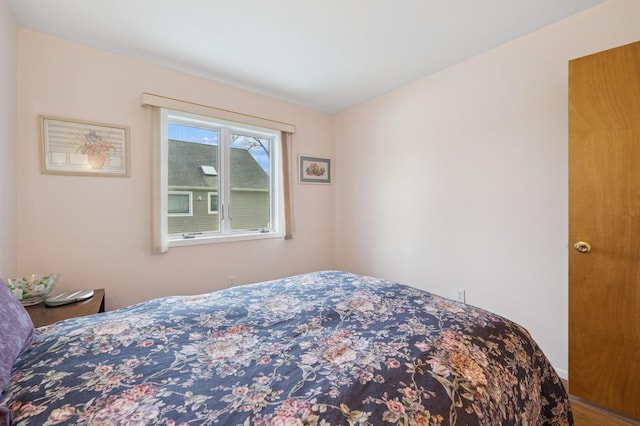 bedroom with wood finished floors