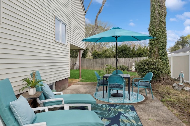 view of patio featuring a fenced backyard and outdoor dining area