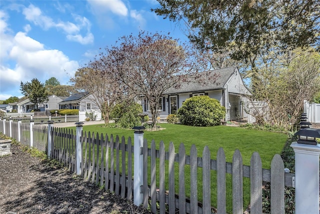 118 Noel Dr, Centereach, NY 11720 - view of front of house featuring a fenced front yard, roof with shingles, and a front lawn