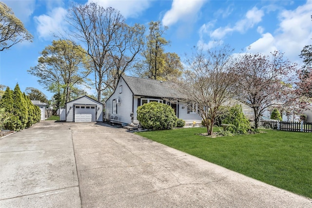 118 Noel Dr, Centereach, NY 11720 - view of side of home featuring fence, a detached garage, driveway, a yard, and an outbuilding