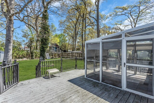 118 Noel Dr, Centereach, NY 11720 - wooden deck featuring a yard, a sunroom, and fence