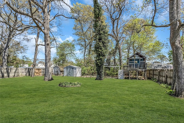 118 Noel Dr, Centereach, NY 11720 - view of yard with a fenced backyard, a storage shed, and an outbuilding