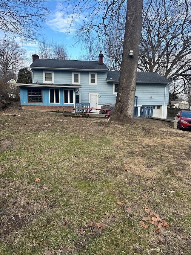 7 Ash St, New Windsor, NY 12553 - rear view of property with a chimney and a yard