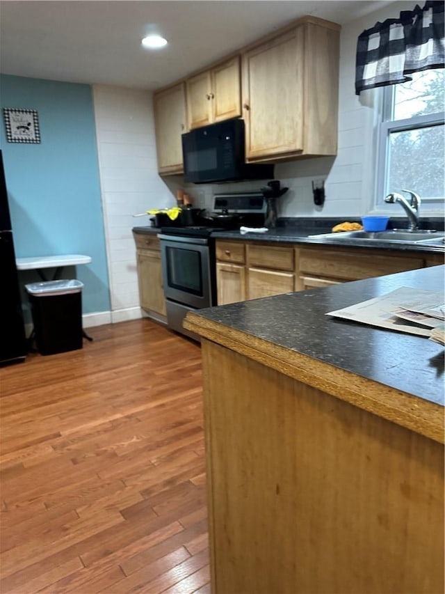 7 Ash St, New Windsor, NY 12553 - kitchen with black appliances, dark countertops, light wood finished floors, a sink, and recessed lighting