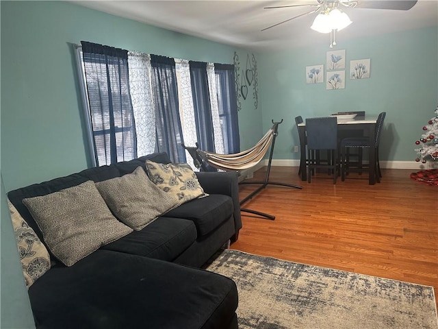7 Ash St, New Windsor, NY 12553 - living room with a ceiling fan, wood finished floors, and baseboards