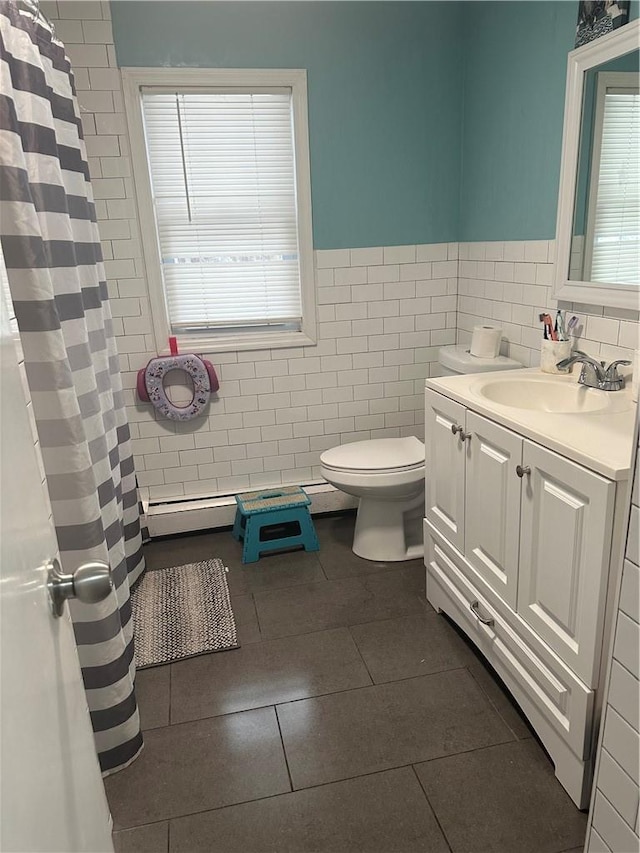7 Ash St, New Windsor, NY 12553 - bathroom featuring tile walls, tile patterned floors, vanity, toilet, and wainscoting
