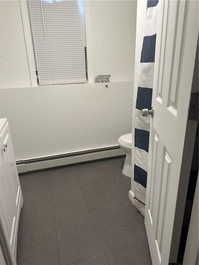 7 Ash St, New Windsor, NY 12553 - full bathroom featuring a baseboard radiator, toilet, tile patterned floors, and vanity