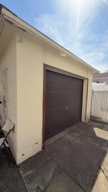 garage with concrete driveway