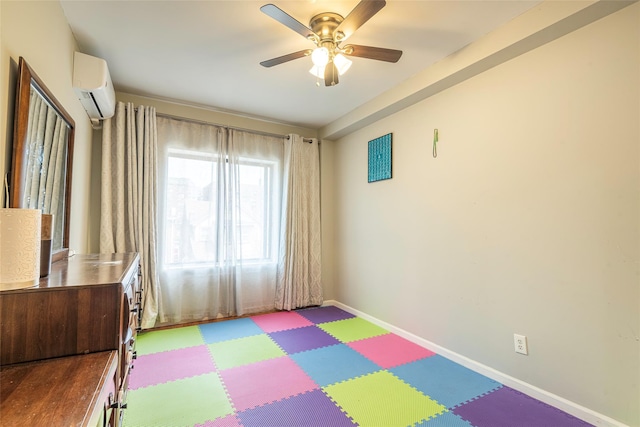 175-26 89th Ave Unit D, Jamaica, NY 11432 - game room with tile patterned floors, baseboards, a ceiling fan, and a wall mounted air conditioner