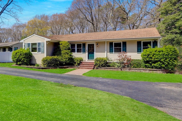 ranch-style house with a front lawn
