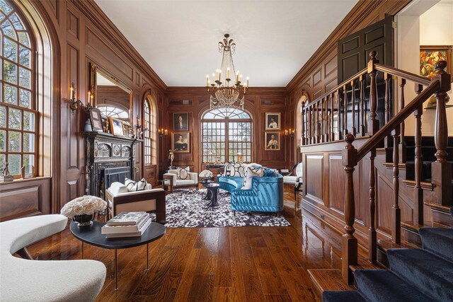 2 Fargo Ln, Irvington, NY 10533 - sitting room featuring stairs, a chandelier, hardwood / wood-style flooring, a fireplace, and crown molding