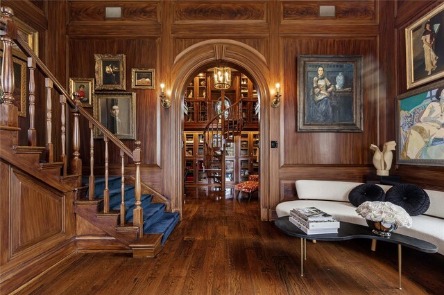 2 Fargo Ln, Irvington, NY 10533 - wine cellar with wood walls, dark wood-style flooring, arched walkways, and a chandelier