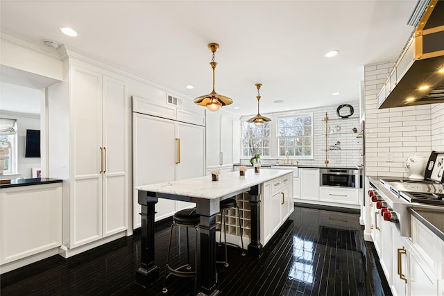 2 Fargo Ln, Irvington, NY 10533 - kitchen with exhaust hood, decorative backsplash, white cabinets, dark wood-style floors, and recessed lighting