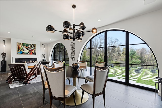 2 Fargo Ln, Irvington, NY 10533 - dining space with recessed lighting, a chandelier, and a lit fireplace