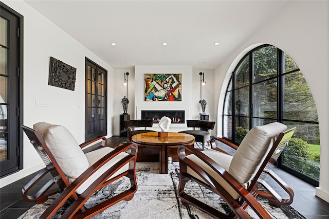 2 Fargo Ln, Irvington, NY 10533 - living area featuring plenty of natural light, a lit fireplace, recessed lighting, and baseboards