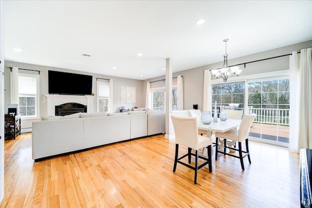 dining room featuring plenty of natural light and light wood-style flooring