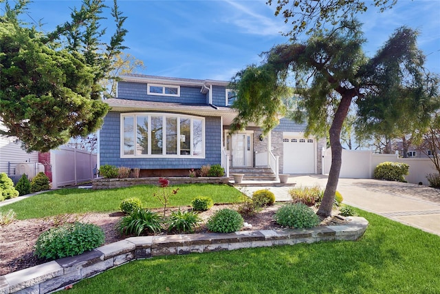 3359 Knight St, Oceanside, NY 11572 - traditional-style house featuring fence, a garage, driveway, and a front yard