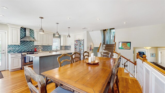3359 Knight St, Oceanside, NY 11572 - dining area with stairs, recessed lighting, and light wood finished floors