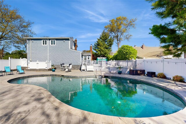 3359 Knight St, Oceanside, NY 11572 - view of swimming pool featuring a fenced in pool, a fenced backyard, a deck, and a patio
