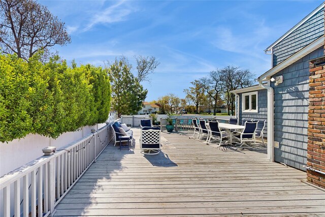 3359 Knight St, Oceanside, NY 11572 - wooden terrace with outdoor dining space and a fenced backyard