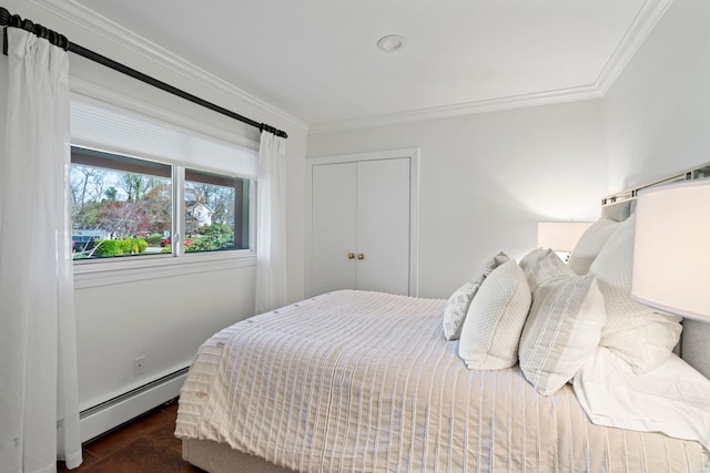 bedroom featuring ornamental molding, a closet, and a baseboard radiator