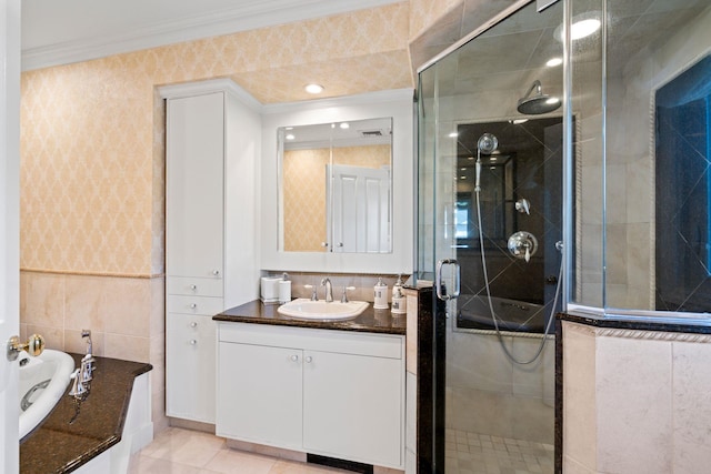 bathroom with a garden tub, a shower stall, ornamental molding, and vanity