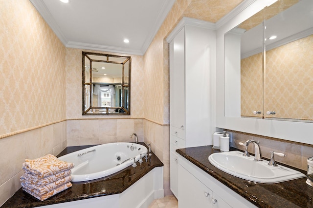 full bath featuring wallpapered walls, a tub with jets, ornamental molding, and vanity