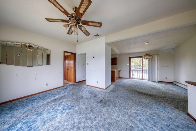 unfurnished room with a ceiling fan, visible vents, baseboards, a baseboard heating unit, and carpet