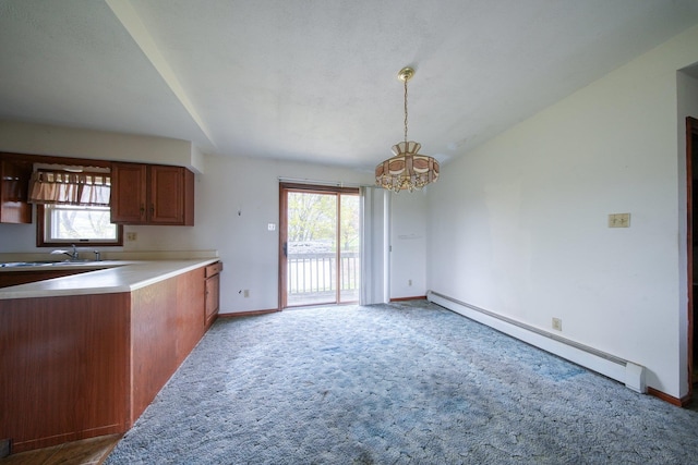 kitchen with light colored carpet, baseboards, a notable chandelier, and baseboard heating