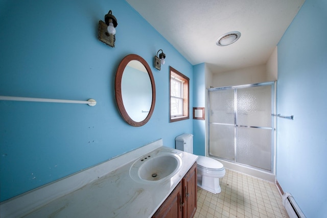 full bath featuring vanity, toilet, baseboards, baseboard heating, and a shower stall