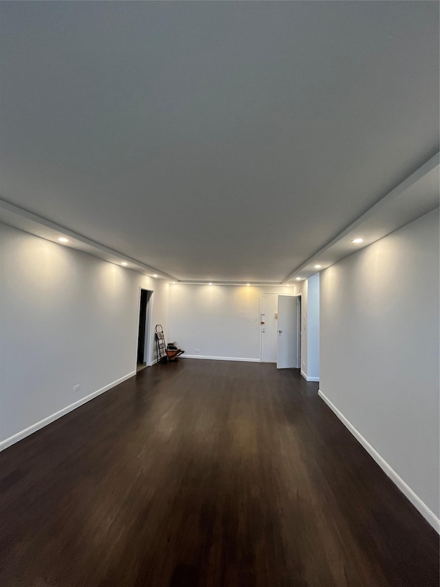 1 Bay Club Dr Unit 9N, Bayside, NY 11360 - unfurnished living room with dark wood-style floors, baseboards, and recessed lighting