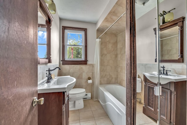 85 Woodard Rd, Parksville, NY 12768 - bathroom with toilet, tile walls, vanity, tile patterned floors, and shower / tub combo
